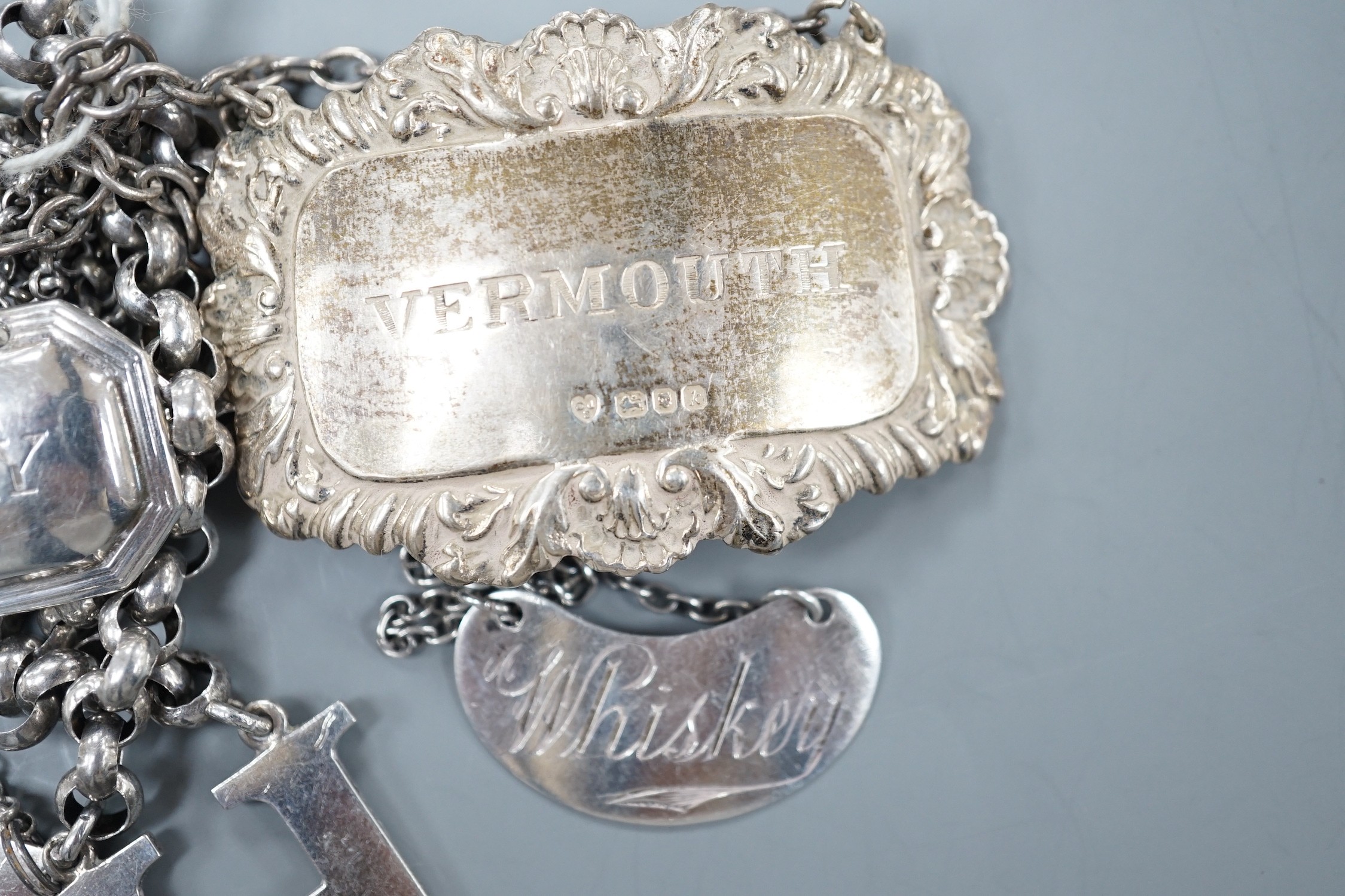 Seven assorted Georgian and later silver wine labels, including Scottish 'H', Robert Gray & Sons, Glasgow, 1837.